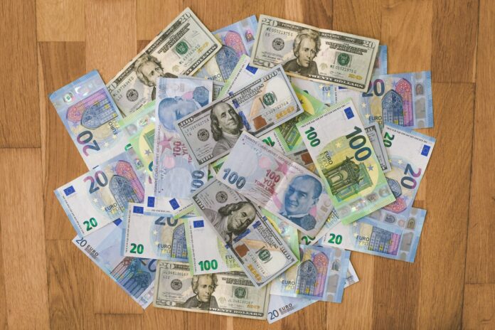 Photo by Ibrahim Boran 10 and 20 banknotes on brown wooden table