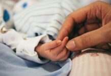 저출생 극복을 위한 임신·출산 지원사업 확대 시행 person holding baby's index finger