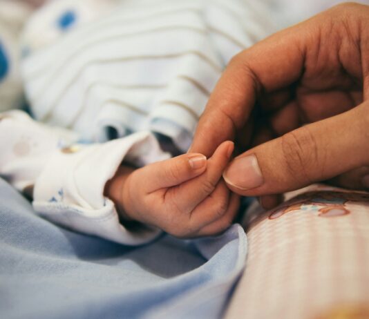 저출생 극복을 위한 임신·출산 지원사업 확대 시행 person holding baby's index finger