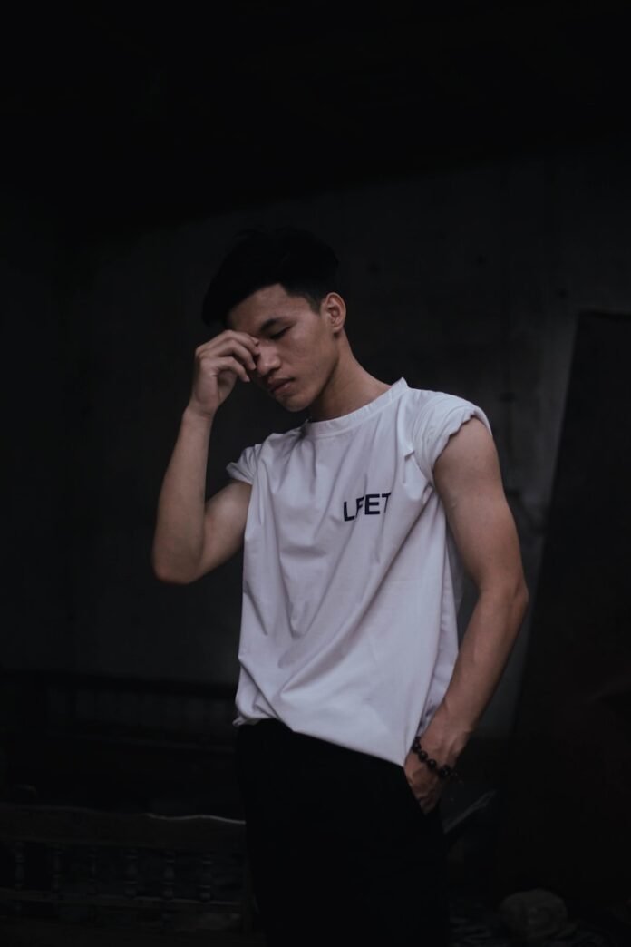 Photo by Quỳnh Lê Mạnh man in white adidas crew neck t-shirt