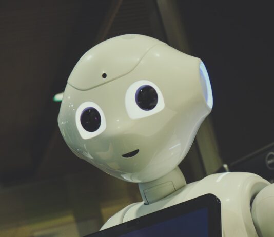 일상 속 건강 지킴이, AI가 알려주는 맞춤형 습관 white robot toy holding black tablet